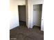 This bedroom has carpet floors, a closet, and a door at 5213 Castle Butte Ct, North Las Vegas, NV 89031