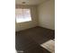 Bedroom features neutral walls, plush carpet, and natural light at 5213 Castle Butte Ct, North Las Vegas, NV 89031