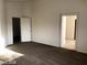 Neutral walls and carpet flooring are viewed in this spacious bedroom at 5213 Castle Butte Ct, North Las Vegas, NV 89031