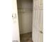 This closet is compact and features a single shelf and neutral paint at 5213 Castle Butte Ct, North Las Vegas, NV 89031