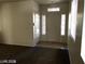 Bright entryway featuring tiled floor, front door, and natural light at 5213 Castle Butte Ct, North Las Vegas, NV 89031