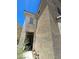 Stucco home with an arched window and dark green front door at 5213 Castle Butte Ct, North Las Vegas, NV 89031