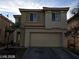 Two-story home featuring a spacious two-car garage and neutral stucco at 5213 Castle Butte Ct, North Las Vegas, NV 89031