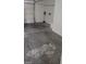 View of the spacious attached garage with a white door at 5213 Castle Butte Ct, North Las Vegas, NV 89031