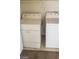 Bright laundry room featuring a white washer and dryer at 5213 Castle Butte Ct, North Las Vegas, NV 89031