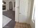 Inviting space with white door, tile foyer, and access to carpeted living room at 5213 Castle Butte Ct, North Las Vegas, NV 89031