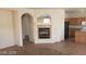 Living room showcasing an electric fireplace and seamless flow into the kitchen at 5213 Castle Butte Ct, North Las Vegas, NV 89031