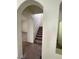 Carpeted staircase with white railing and neutral walls at 5213 Castle Butte Ct, North Las Vegas, NV 89031