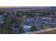 Expansive aerial view of a neighborhood highlighting the home's pool and surrounding greenery at 5239 Somerset Dr, Las Vegas, NV 89120