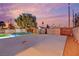 Large backyard featuring a pool, storage sheds, and plenty of space for outdoor activities at 5239 Somerset Dr, Las Vegas, NV 89120