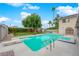 Inviting backyard pool with diving board and lush green landscaping, great for recreation at 5239 Somerset Dr, Las Vegas, NV 89120