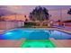 A stunning pool and spa are surrounded by beautiful greenery, creating an inviting outdoor oasis at 5239 Somerset Dr, Las Vegas, NV 89120