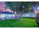 Lush green backyard with a private pool, mature trees, and a storage shed at 5239 Somerset Dr, Las Vegas, NV 89120
