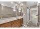 Bathroom featuring a large mirror, vanity with cabinets, walk-in shower and neutral walls at 5239 Somerset Dr, Las Vegas, NV 89120