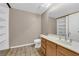 Well-lit bathroom featuring a double sink vanity and tile flooring at 5239 Somerset Dr, Las Vegas, NV 89120