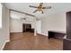 This bedroom features wood floors, a sliding mirror door closet, and a ceiling fan at 5239 Somerset Dr, Las Vegas, NV 89120