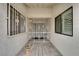 Enclosed front entrance with security gate and textured wall at 5239 Somerset Dr, Las Vegas, NV 89120