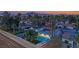 Beautiful exterior view of a home with solar panels, lush landscaping, and a refreshing swimming pool at 5239 Somerset Dr, Las Vegas, NV 89120