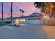 Single-story home showcasing desert landscaping, two car garage, and desert themed curb appeal at 5239 Somerset Dr, Las Vegas, NV 89120