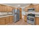 Bright kitchen featuring wood cabinets, stainless appliances, and granite countertops at 5239 Somerset Dr, Las Vegas, NV 89120