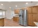 Bright kitchen features wood cabinets, granite countertops and stainless steel appliances at 5239 Somerset Dr, Las Vegas, NV 89120