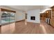 Bright living room with a view of the pool, hardwood floors, and fireplace at 5239 Somerset Dr, Las Vegas, NV 89120