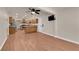 Living room features laminate flooring and open access to kitchen at 5239 Somerset Dr, Las Vegas, NV 89120