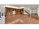 Spacious living room featuring hardwood floors, built-in shelving and staircase at 5239 Somerset Dr, Las Vegas, NV 89120