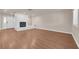 Spacious living room features bright neutral walls and beautiful wood flooring at 5239 Somerset Dr, Las Vegas, NV 89120
