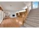 Bright living room with hardwood floors, fireplace, and staircase at 5239 Somerset Dr, Las Vegas, NV 89120