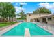 Outdoor pool with diving board, spa and covered patio in backyard of home at 5239 Somerset Dr, Las Vegas, NV 89120