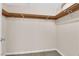 Walk-in closet with neutral walls and carpet featuring wooden clothing racks at 5239 Somerset Dr, Las Vegas, NV 89120