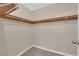 Bright walk-in closet with neutral walls, carpet, and wooden clothing racks at 5239 Somerset Dr, Las Vegas, NV 89120