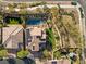 Aerial view showcasing the backyard pool and spa, solar panels and lush landscaping at 541 Green Sage Way, Las Vegas, NV 89138