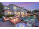 Relaxing backyard with a fire pit, spa, and outdoor seating ideal for enjoying evenings under the sky at 541 Green Sage Way, Las Vegas, NV 89138