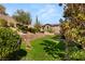 Grassy backyard with tiered landscaping and views of the home at 541 Green Sage Way, Las Vegas, NV 89138