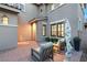 Charming exterior with stone-paved patio, lush bushes, statue, and natural light at 541 Green Sage Way, Las Vegas, NV 89138