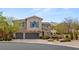Elegant two-story home with a three-car garage, mature landscaping, and desert mountain backdrop at 541 Green Sage Way, Las Vegas, NV 89138