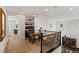 Bright hallway landing with decorative shelving and vintage-styled desk with a wrought iron banister at 541 Green Sage Way, Las Vegas, NV 89138