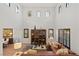 Bright living room with soaring ceilings, hardwood floors, and stylish decor, great for relaxation or entertaining at 541 Green Sage Way, Las Vegas, NV 89138