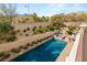 Stunning pool and spa with meticulous landscaping offers a relaxing outdoor oasis and mountain views at 541 Green Sage Way, Las Vegas, NV 89138