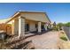 Enjoy this covered back patio that offers ample room for outdoor seating and entertainment at 5524 E San Pietro Dr, Pahrump, NV 89061