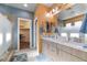 Main bathroom featuring double sinks, marble countertops, and glass enclosed walk-in shower at 5524 E San Pietro Dr, Pahrump, NV 89061