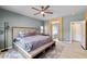 Spacious main bedroom featuring a king bed, ceiling fan, and en-suite bathroom at 5524 E San Pietro Dr, Pahrump, NV 89061