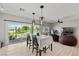 Dining area with modern pendant lighting and access to backyard at 5524 E San Pietro Dr, Pahrump, NV 89061