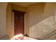 Warm and inviting front door with decorative glass window and secure lock system at 5524 E San Pietro Dr, Pahrump, NV 89061