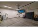 Spacious garage with ample storage, overhead racks, and room for vehicles and equipment at 5524 E San Pietro Dr, Pahrump, NV 89061