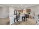 Open-concept kitchen with a large island, stainless steel appliances, and light wood cabinets at 5524 E San Pietro Dr, Pahrump, NV 89061