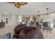 Open-concept living space showing beanbag seating, dining area, and kitchen at 5524 E San Pietro Dr, Pahrump, NV 89061