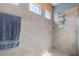 Walk-in shower featuring beige tile and transom windows for natural light at 5524 E San Pietro Dr, Pahrump, NV 89061